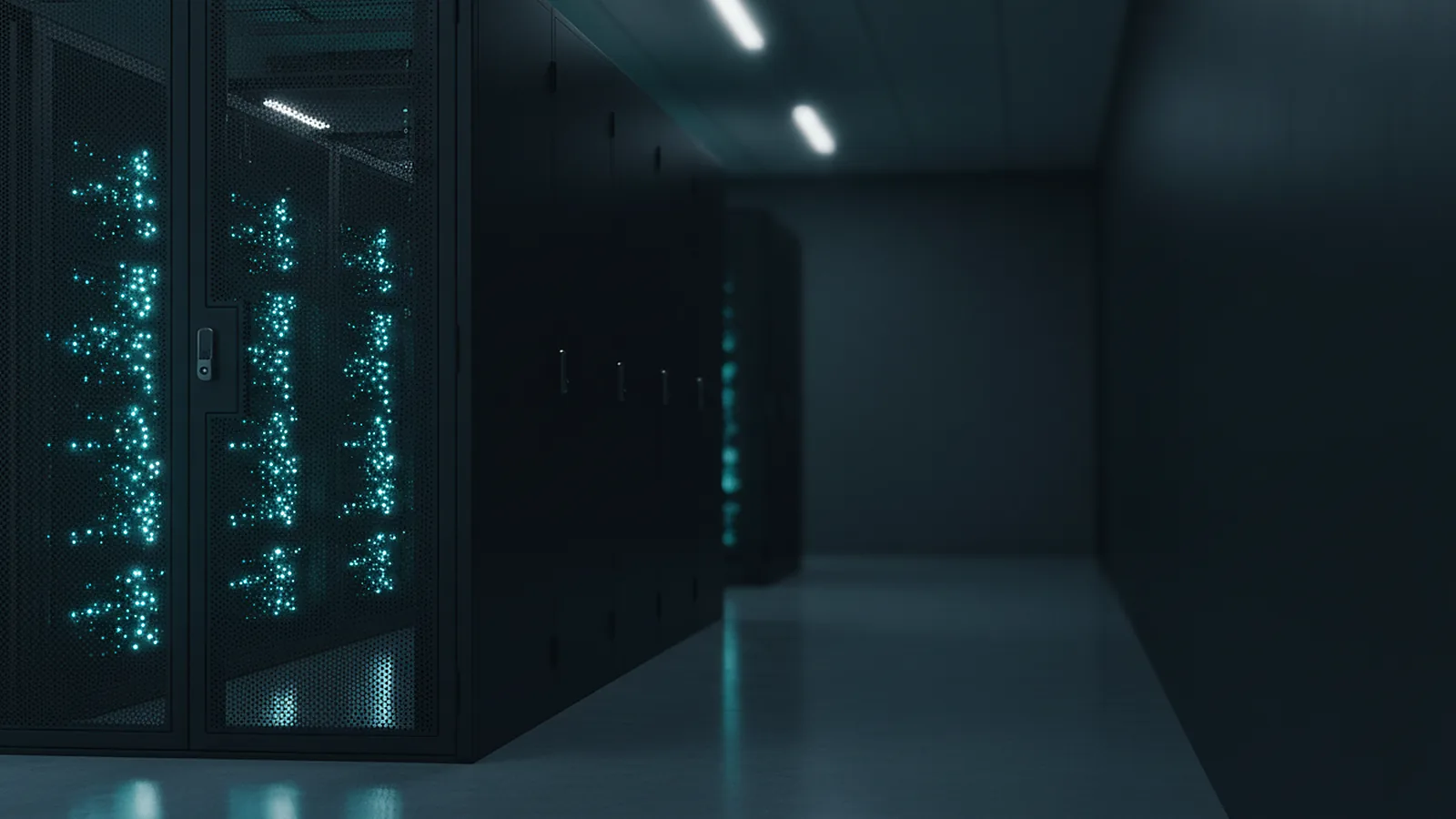 An aisle of black server racks with small cyan status lights inside a data center